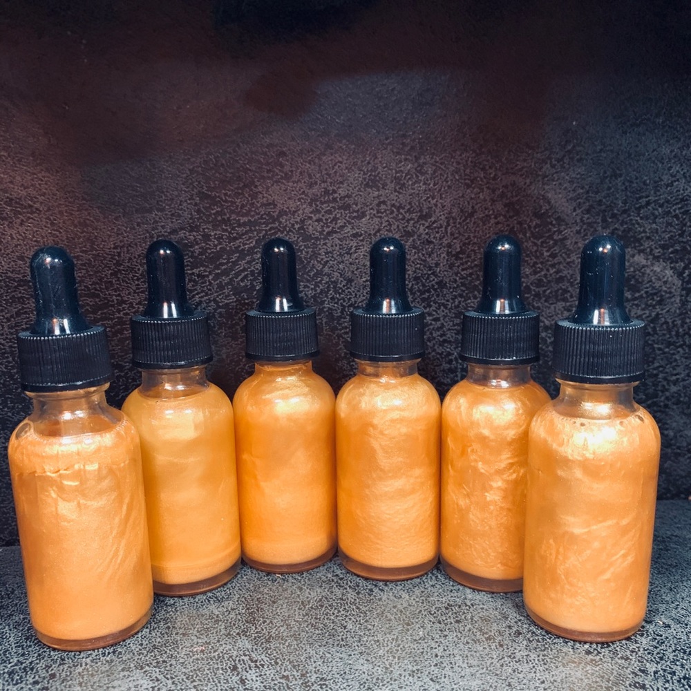 Gold body oil shimmer